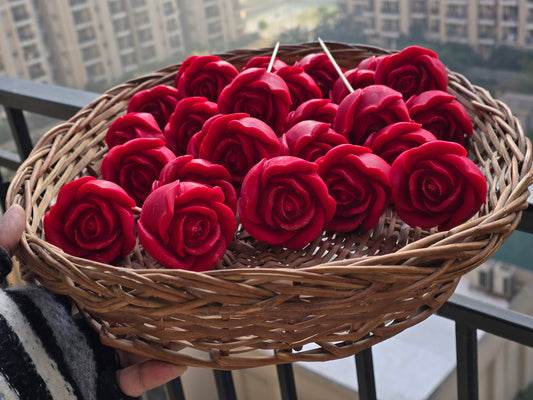 Handcrafted red rose-shaped soy wax candles in a wicker basket, Fiorance Luxe India.