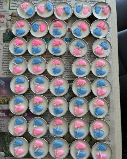 Handcrafted soy wax candles with pink and blue baby feet design by Fiorance Luxe