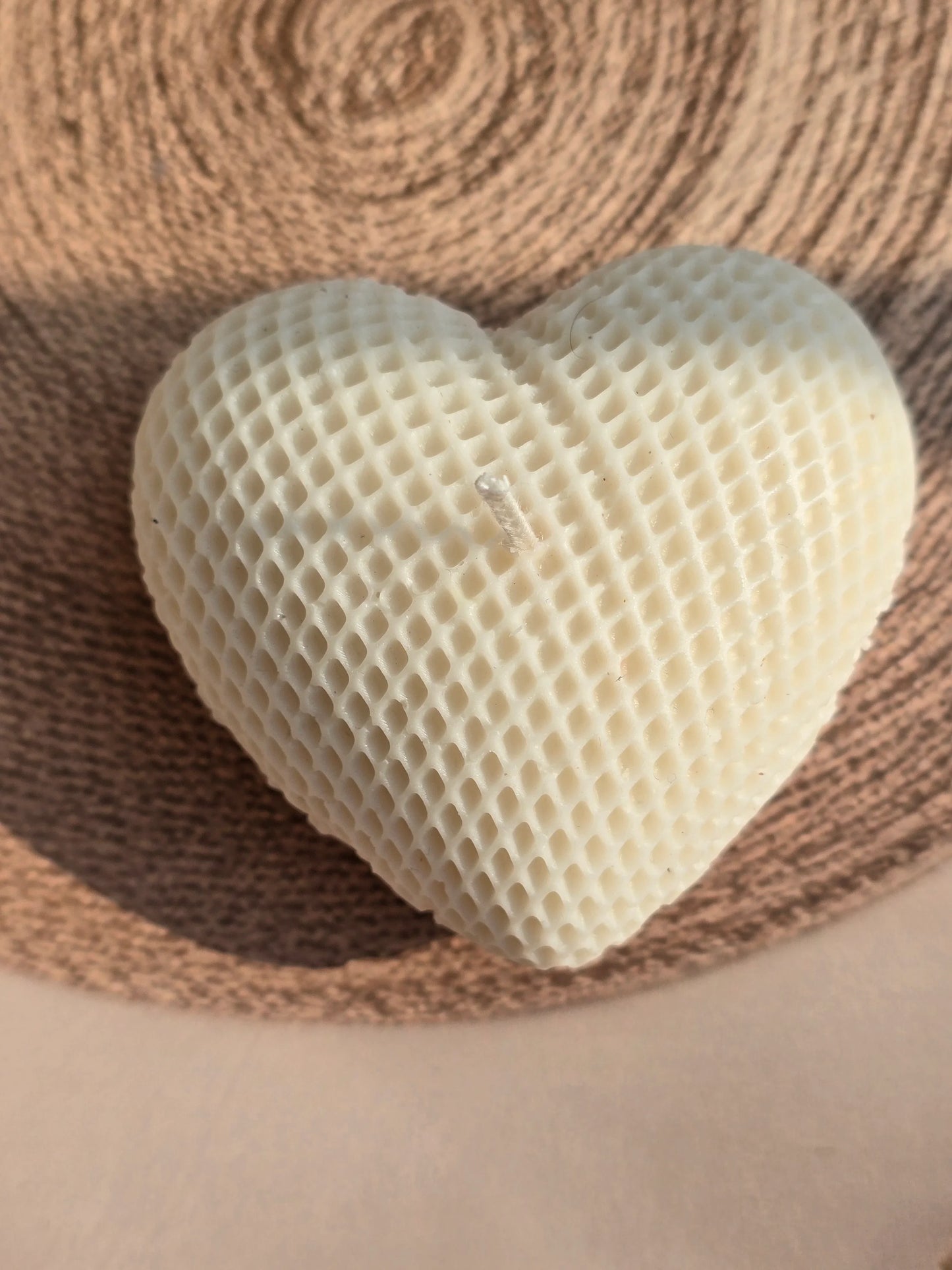 Heart-shaped honeycomb on a woven surface