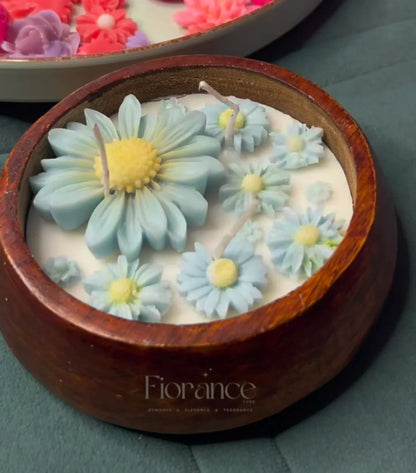 Fiorance Luxe soy wax floral candle with blue daisy designs in a wooden bowl, luxury home decor