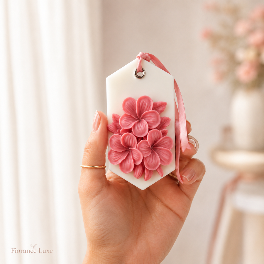 Hand holding Fiorance Luxe cherry blossom wax sachet – handmade pink floral scented soy wax sachet for gifting