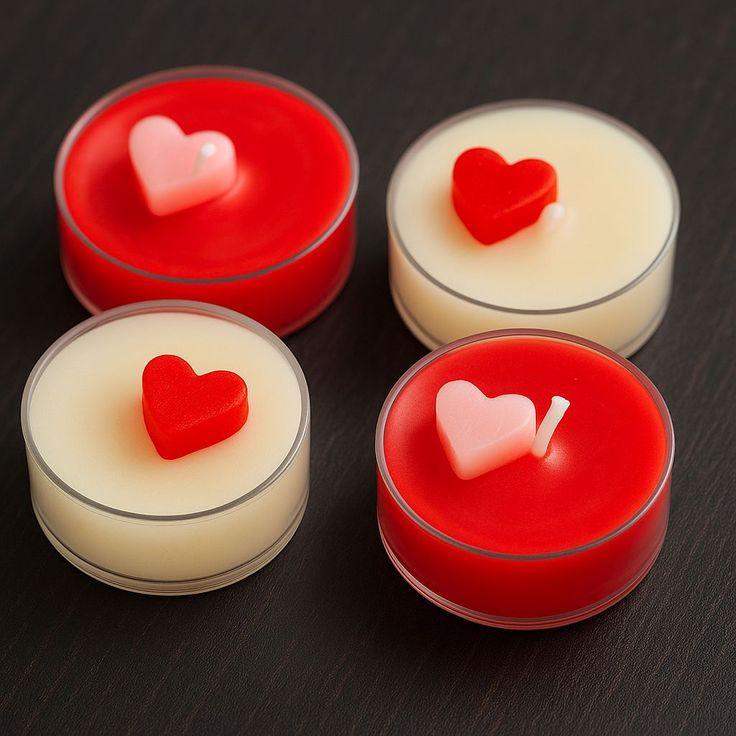 Heart-shaped soy wax floral candles by Fiorance Luxe on a dark surface, ideal for gifting.