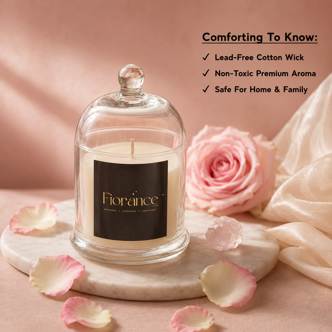 Bell jar Candle in a glass dome with a pink rose and petals on a soft pink background, featuring the brand 'Fiorance'.