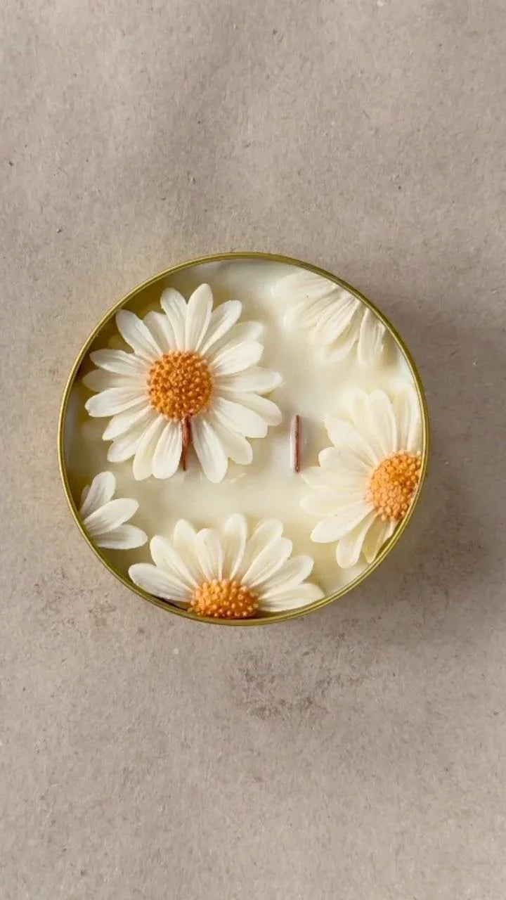 Decorative plate with white flowers and orange centers on a beige background