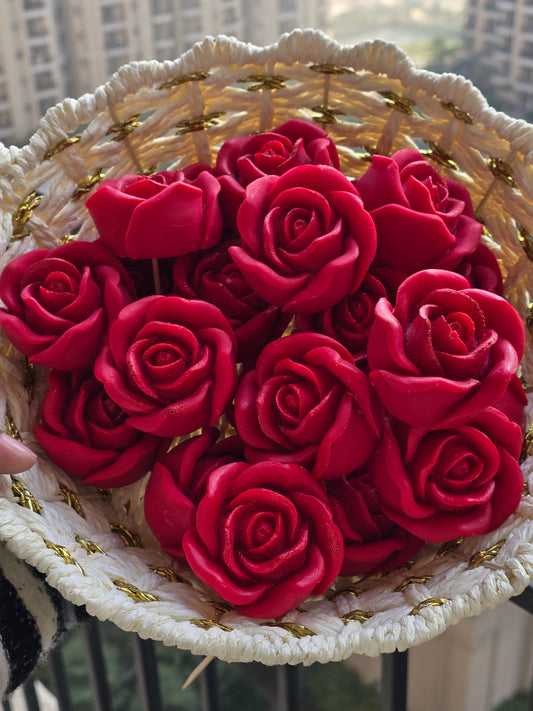 Handwoven basket filled with red floral soy wax candles by Fiorance Luxe