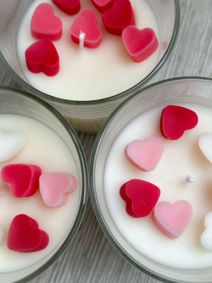 Fiorance Luxe luxury soy wax candles topped with red and pink heart shapes in glass jars