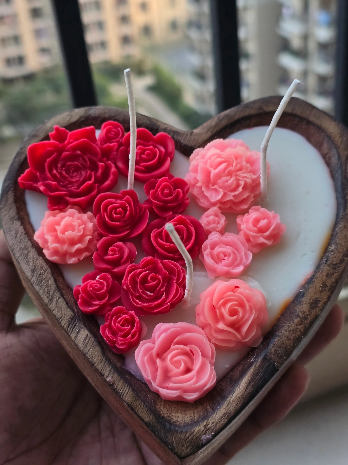 Heart-shaped soy wax candle with pink and red floral designs by Fiorance Luxe