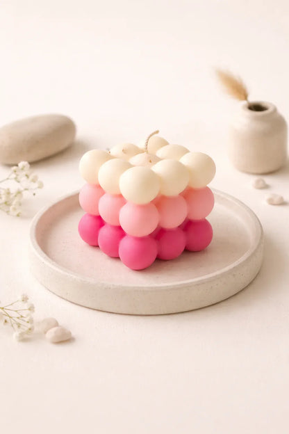 Bubble cube pink and cream soy wax candle by Fiorance Luxe on ceramic plate, elegant decor