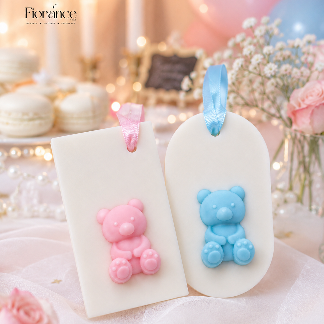 Two wax sachets with pink and blue bear figurines on a blurred festive background.