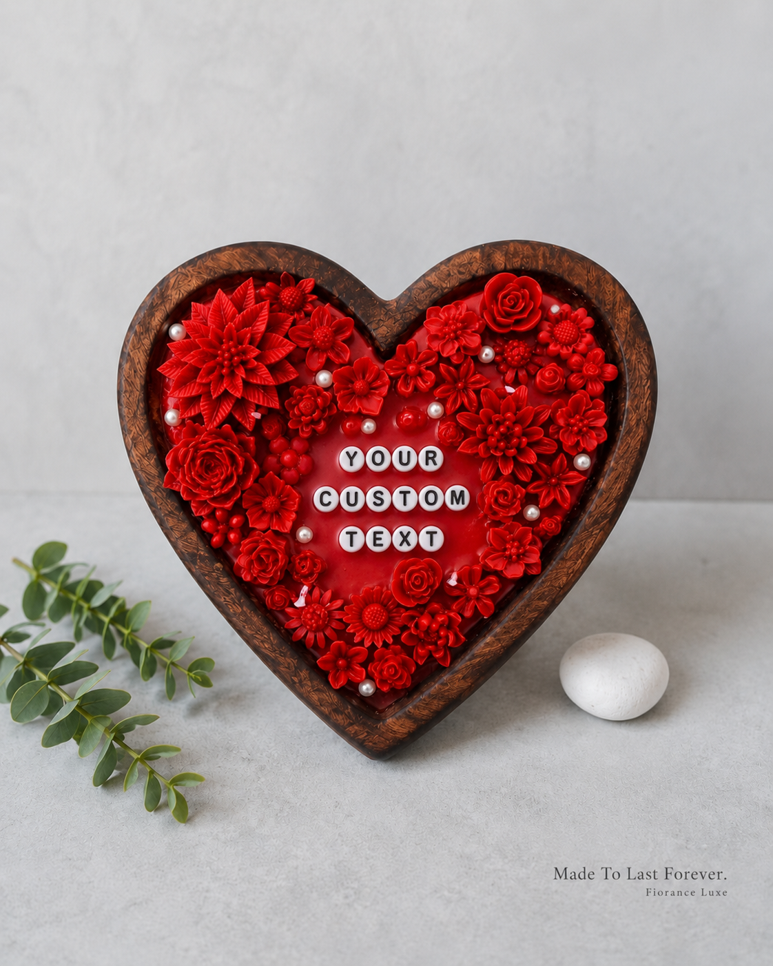 Heart-shaped decorative piece with red flowers and customizable text on a light gray background