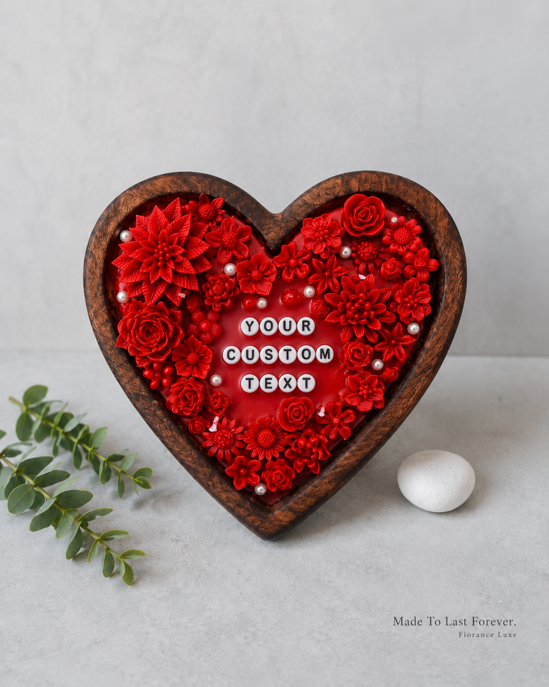Heart-shaped decorative piece with red flowers and customizable text on a light gray background